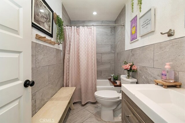 12113 Beverly Blvd Unit A, Whittier, CA 90601 - bathroom with tile walls, toilet, vanity, and shower / tub combo
