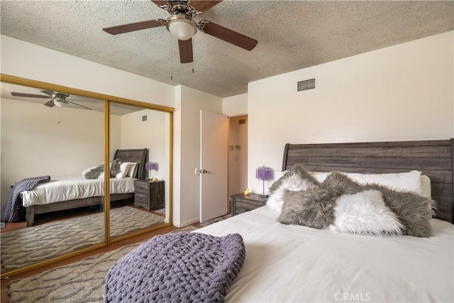 19264 Casmalia St, Rialto, CA 92377 - bedroom with a closet, a textured ceiling, a ceiling fan, and wood finished floors