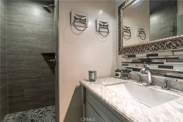 19264 Casmalia St, Rialto, CA 92377 - bathroom featuring a tile shower and vanity