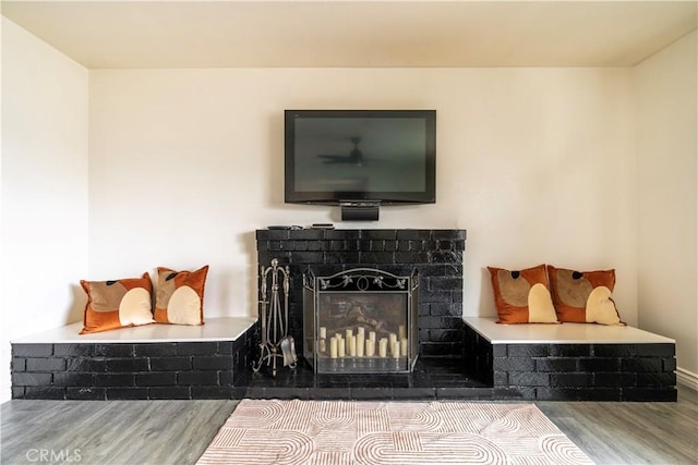 19264 Casmalia St, Rialto, CA 92377 - detailed view of wood finished floors, a fireplace, and baseboards