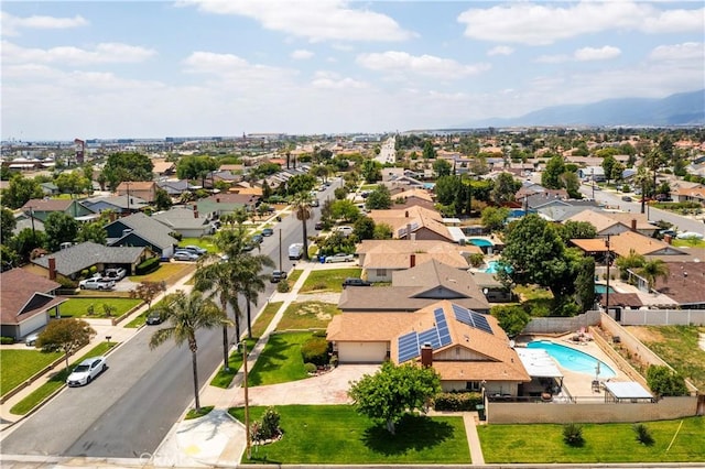 19264 Casmalia St, Rialto, CA 92377 - aerial perspective of suburban area featuring a pool and a mountain backdrop