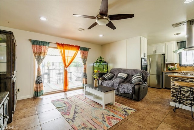 19264 Casmalia St, Rialto, CA 92377 - tiled living area featuring healthy amount of natural light, ceiling fan, recessed lighting, and baseboards