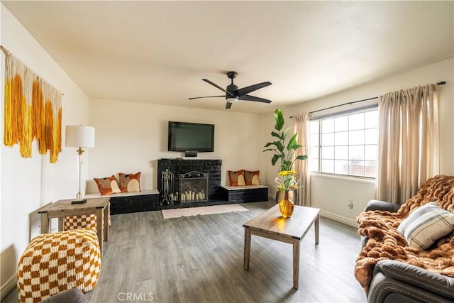 19264 Casmalia St, Rialto, CA 92377 - living room with wood finished floors, ceiling fan, baseboards, and a fireplace