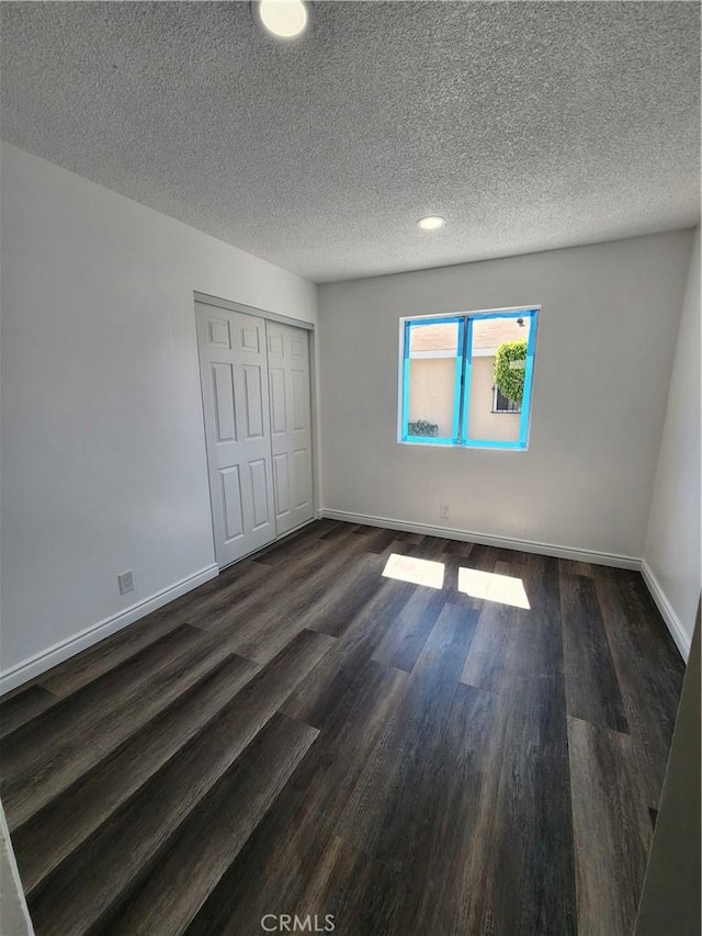 1451 W 146th St, Gardena, CA 90247 - unfurnished bedroom with dark wood-style flooring, baseboards, a closet, a textured ceiling, and recessed lighting
