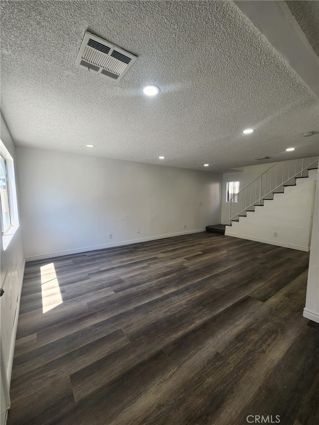 1451 W 146th St, Gardena, CA 90247 - basement with stairway, dark wood-style flooring, baseboards, recessed lighting, and a textured ceiling