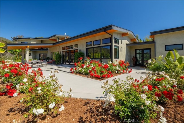 1088 Via Conca Doro, Vista, CA 92084 - back of house with french doors, stucco siding, and a patio