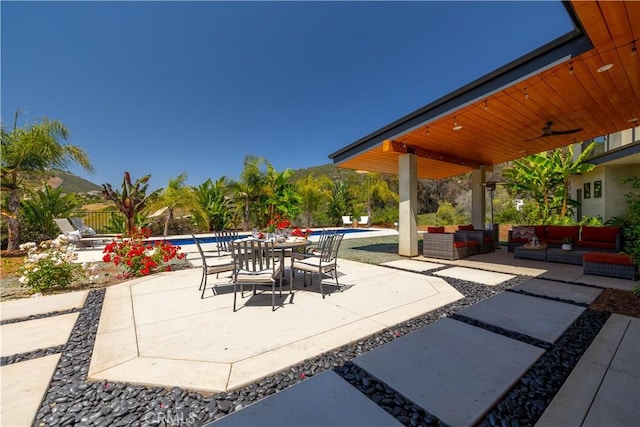 1088 Via Conca Doro, Vista, CA 92084 - view of patio / terrace featuring an outdoor living space, an outdoor pool, a ceiling fan, and outdoor dining space