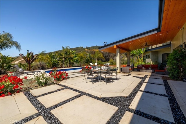 1088 Via Conca Doro, Vista, CA 92084 - view of patio / terrace with a ceiling fan, outdoor dining space, an outdoor pool, a mountain view, and outdoor lounge area
