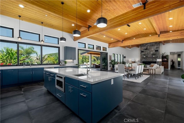 1088 Via Conca Doro, Vista, CA 92084 - kitchen with a sink, wood ceiling with exposed beams, blue cabinetry, recessed lighting, and light countertops