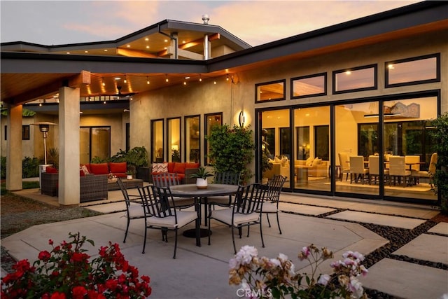 1088 Via Conca Doro, Vista, CA 92084 - patio terrace at dusk with an outdoor living space, a patio area, and outdoor dining space