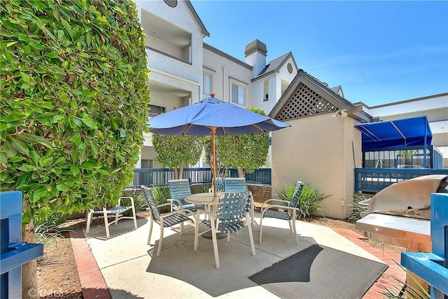 view of patio featuring outdoor dining space
