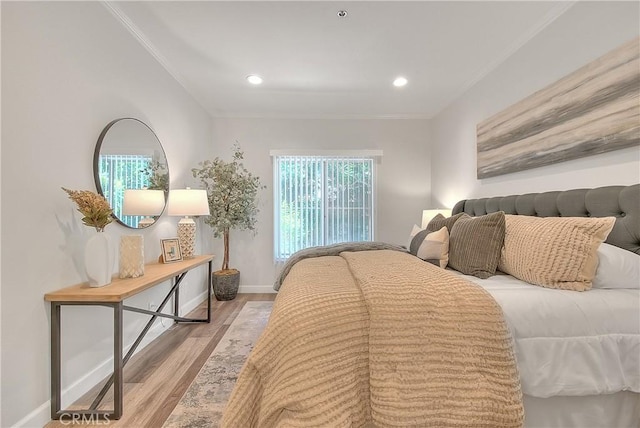 bedroom featuring wood finished floors, baseboards, ornamental molding, and recessed lighting