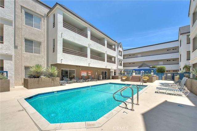 community pool featuring a patio