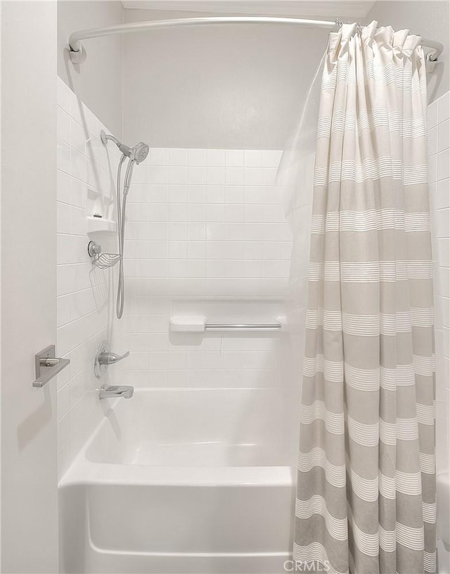 bathroom featuring shower / bath combo with shower curtain