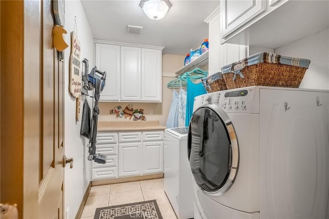 330 E Gladstone St, San Dimas, CA 91773 - laundry room featuring cabinet space, light tile patterned floors, and independent washer and dryer