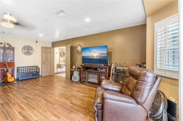 330 E Gladstone St, San Dimas, CA 91773 - living room featuring wood finished floors, recessed lighting, and a textured ceiling
