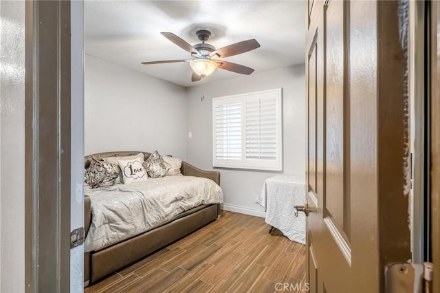 330 E Gladstone St, San Dimas, CA 91773 - bedroom with wood finished floors, baseboards, and a ceiling fan