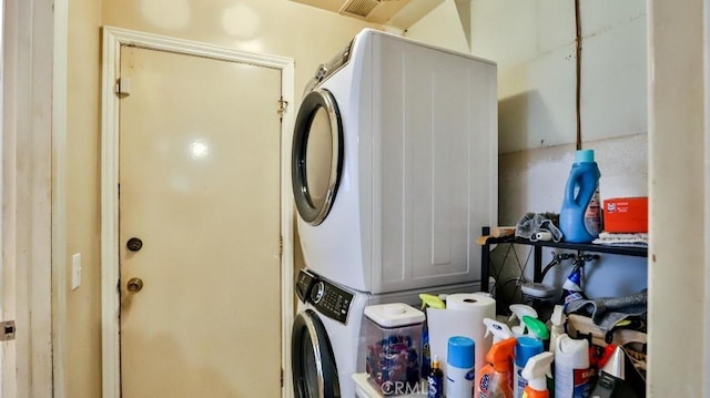 laundry room with stacked washer / drying machine
