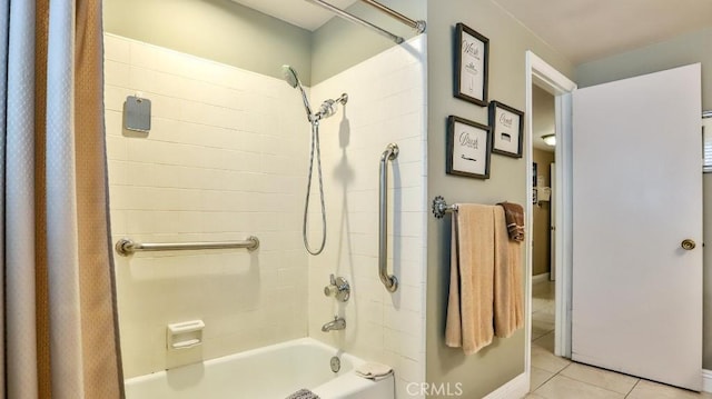 bathroom featuring tile patterned floors and shower / bath combination with curtain