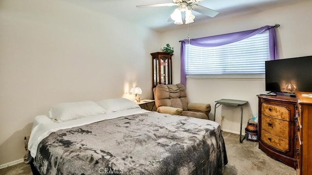 bedroom with carpet flooring, baseboards, and ceiling fan