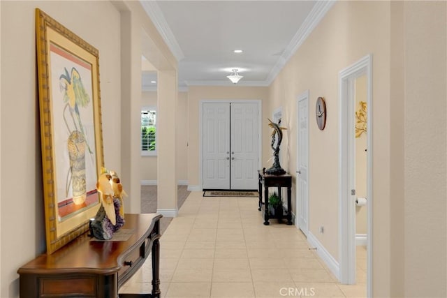 foyer with baseboards, crown molding, light tile patterned floors, and recessed lighting