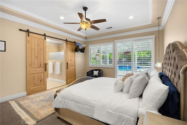 bedroom featuring a barn door, ornamental molding, access to exterior, baseboards, and ceiling fan
