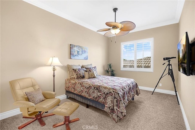 bedroom featuring carpet floors, ornamental molding, baseboards, and ceiling fan