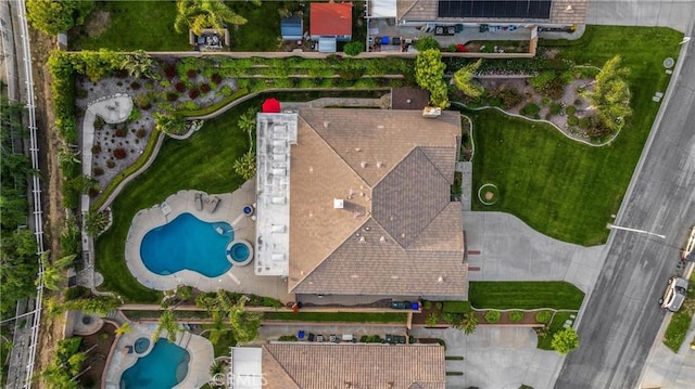 drone / aerial view of a pool