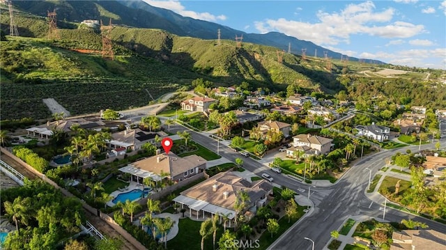 4976 Huntswood Pl, Rancho Cucamonga, CA 91737 - aerial overview of property's location featuring nearby suburban area and mountains