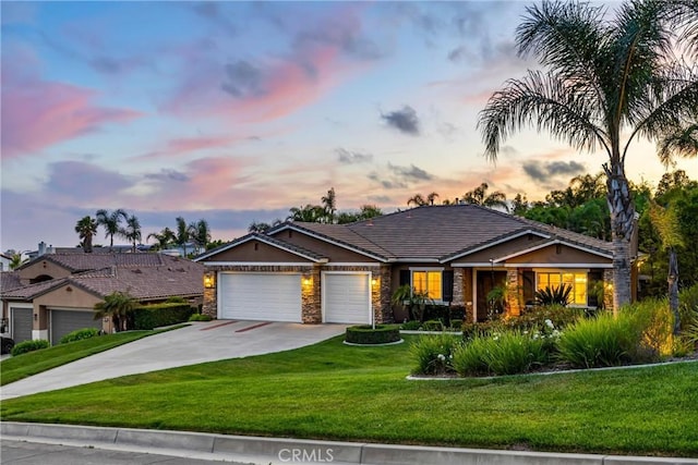 4976 Huntswood Pl, Rancho Cucamonga, CA 91737 - ranch-style house with an attached garage, concrete driveway, a front lawn, stone siding, and stucco siding