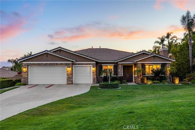 single story home featuring a garage, stone siding, a lawn, and concrete driveway