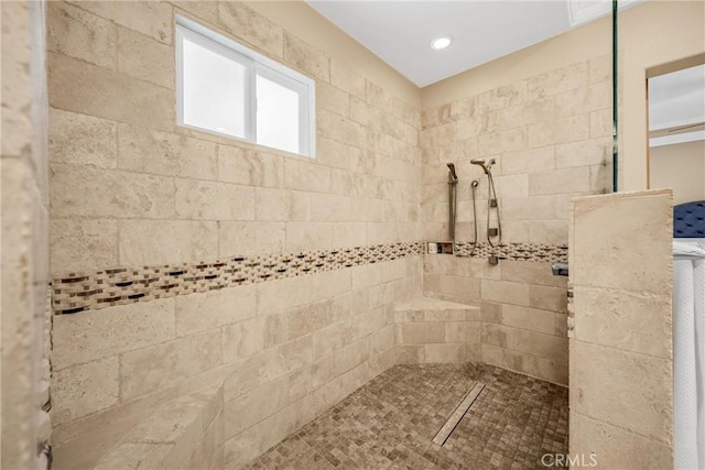 full bath featuring tiled shower