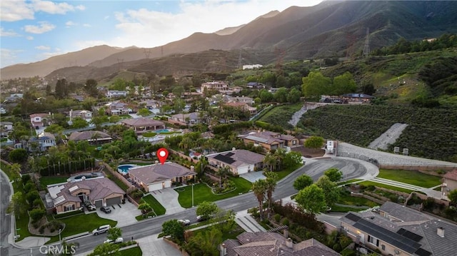 4976 Huntswood Pl, Rancho Cucamonga, CA 91737 - aerial overview of property's location featuring a mountain backdrop and nearby suburban area
