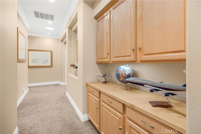 hallway with crown molding, light colored carpet, baseboards, and recessed lighting