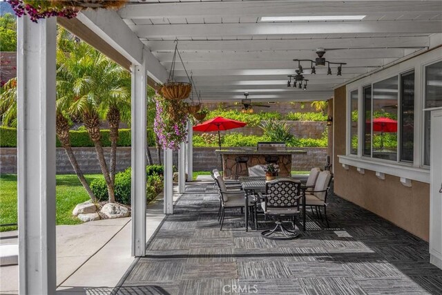 view of patio / terrace with outdoor dining space and a ceiling fan