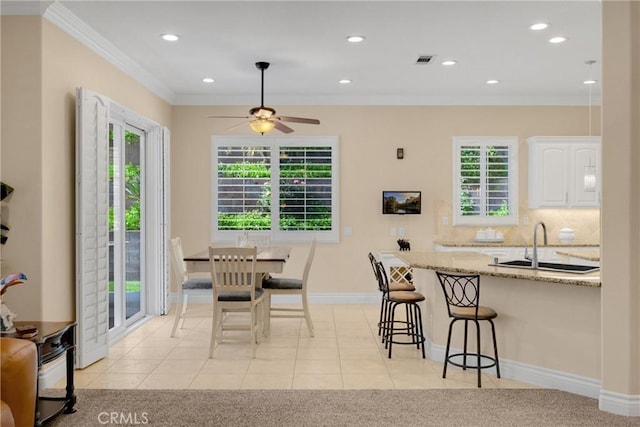 dining area with plenty of natural light, recessed lighting, light tile patterned flooring, a ceiling fan, and ornamental molding