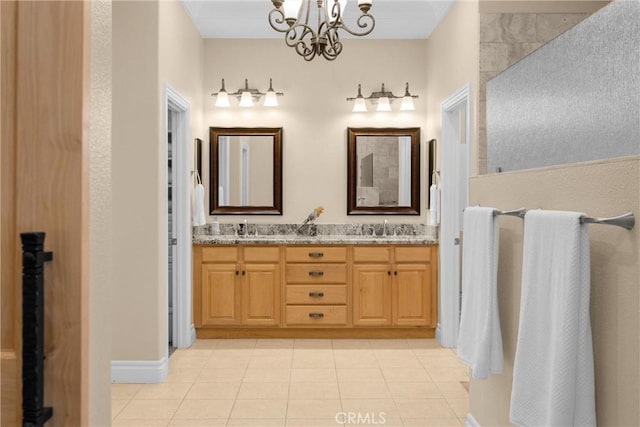 full bathroom with tile patterned flooring, a chandelier, and double vanity