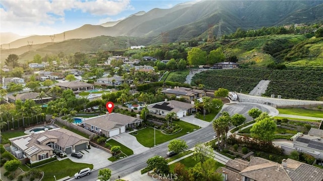 aerial perspective of suburban area featuring a mountainous background