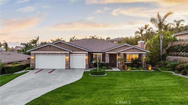 single story home featuring a garage, driveway, a lawn, stone siding, and a chimney