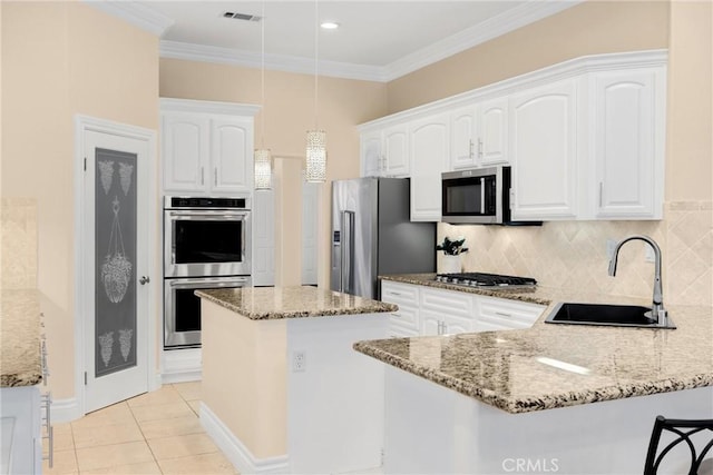 4976 Huntswood Pl, Rancho Cucamonga, CA 91737 - kitchen featuring stainless steel appliances, a peninsula, light stone counters, white cabinetry, and crown molding