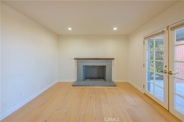 26710 Camino Seco, Temecula, CA 92590 - unfurnished living room featuring wood finished floors, baseboards, french doors, a fireplace, and recessed lighting