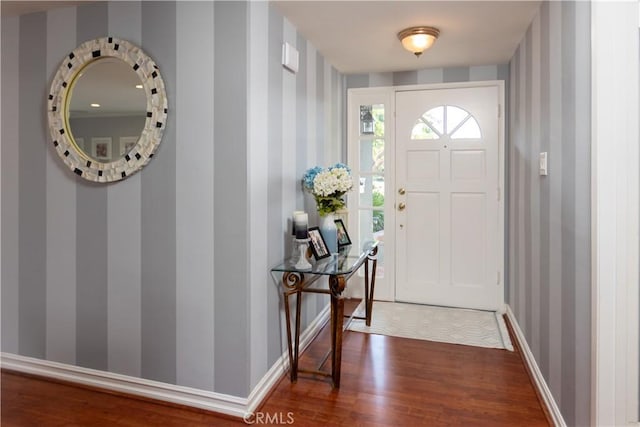 2952 Pemba Dr, Costa Mesa, CA 92626 - foyer entrance featuring wallpapered walls, dark wood-style floors, and baseboards