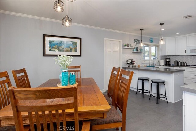 2952 Pemba Dr, Costa Mesa, CA 92626 - dining area featuring crown molding and recessed lighting