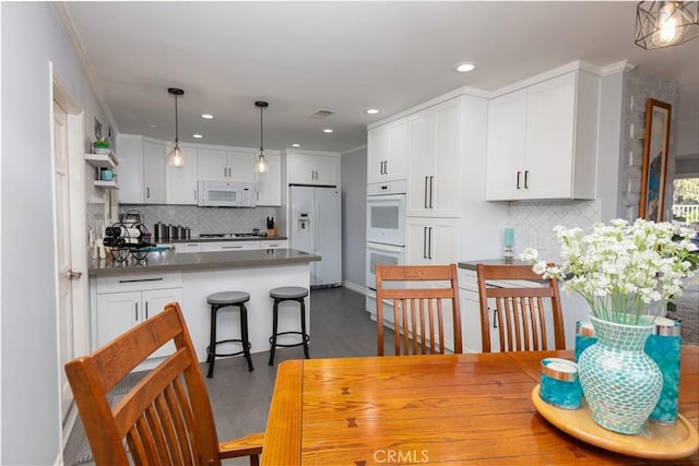 2952 Pemba Dr, Costa Mesa, CA 92626 - dining room featuring dark wood-style flooring and recessed lighting