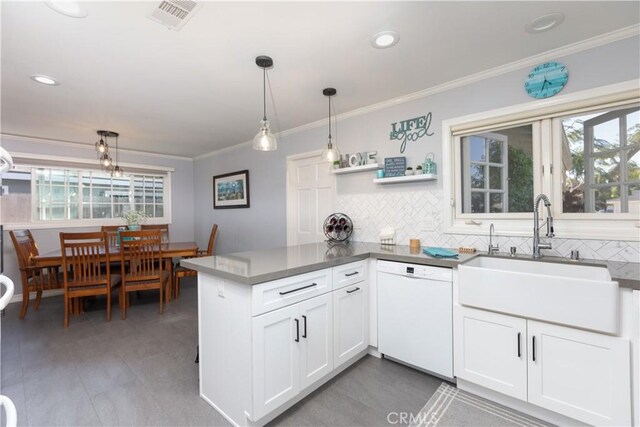 2952 Pemba Dr, Costa Mesa, CA 92626 - kitchen featuring dishwasher, a sink, tasteful backsplash, ornamental molding, and plenty of natural light