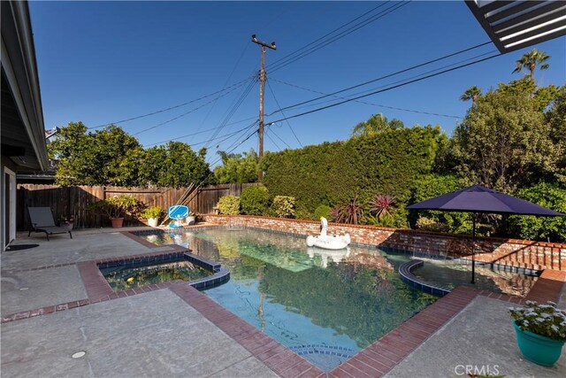 2952 Pemba Dr, Costa Mesa, CA 92626 - view of swimming pool with a fenced backyard, a pool with connected hot tub, and a patio