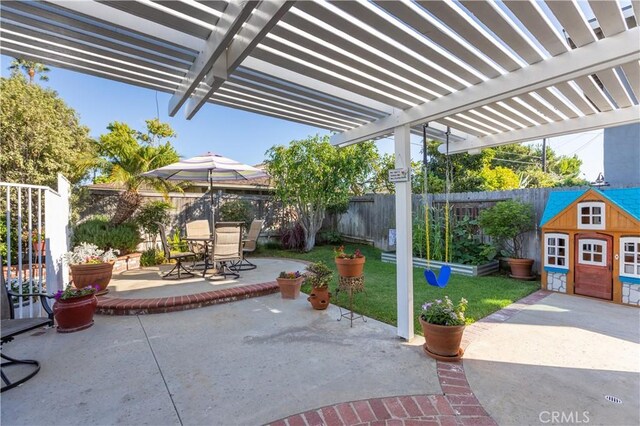 2952 Pemba Dr, Costa Mesa, CA 92626 - fenced backyard featuring outdoor dining space, a patio area, a pergola, and an outdoor structure