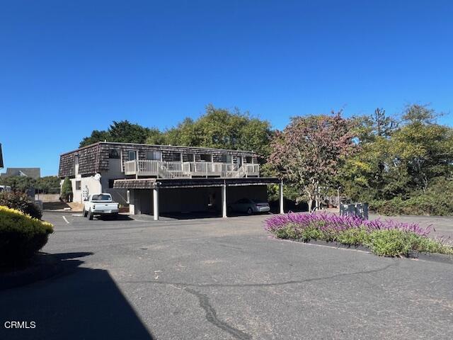 511 Cypress St Unit 4, Fort Bragg, CA 95437 - view of property featuring covered and uncovered parking