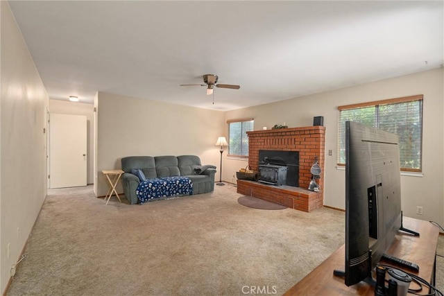 14693 Lafayette Cir, Magalia, CA 95954 - living area featuring ceiling fan, plenty of natural light, a fireplace, and carpet