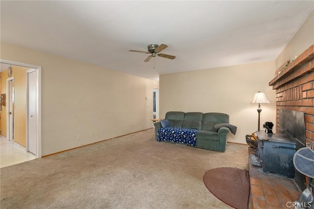 14693 Lafayette Cir, Magalia, CA 95954 - living room featuring ceiling fan, carpet floors, a wood stove, and baseboards